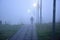 Man walking alone in foggy weather