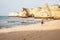 Man walking along beach Portuguese