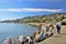 Man walking along a beautiful waterfront town to Sausalito