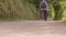 Man walking along a track in the countryside