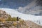 A man walking along the track to see Passu glacier.