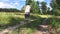 Man walking away on an summer earth path barefoot