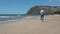 Man Walking On The Beach