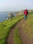 Man walking on a coastal hiking path, south england