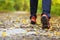 Man walking cross country trail in autumn forest