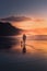 Man walking the dog on beach