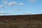 Man walking at flat mountain in Finnmark,  bird hunting for grouse bird