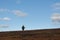 Man walking at flat mountain in Finnmark,  bird hunting for grouse bird