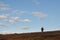 Man walking at flat mountain in Finnmark,  bird hunting for grouse bird