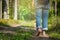 Man walking on footpath forest. Close-up of bare feet soiled with ground. healthy lifestyle.