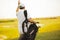 Man walking on golf court and carrying golf bag
