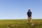 Man Walking Grass Field