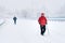 Man walking on a highway covered in snow during heavy snowfall storm in Madrid