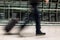 A man walking with luggage in blurred motion