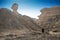 Man walking in the middle of canyons in Namibe, Africa, Angola.