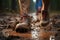 Man walking through mud, splashing water in captivating outdoor adventure