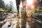 Man walking through mud, splashing water in captivating outdoor adventure