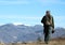 Man walking over the mountains