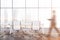 Man walking in panoramic meeting room