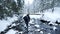 Man walking on rocks in winter river