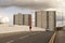 Man walking on S. James bridge with view of tall buildings as background.