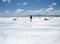 Man walking in a salt field