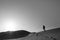 Man walking on sand dune Al Wathba desert, Abu Dhabi, UAE