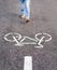 Man walking on separate bicycle lane for riding bicycles breaking rules.