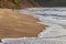 Man walking on the shore of Cabo Ledo beach. Angola. Africa.