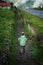 Man Walking on The Side of Tenzingâ€“Hillary Airport Runway, Lukla Nepal