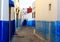 Man walking in the small streets in blue and white in the kasbah of the old city Rabat in Marocco