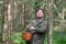 Man walking standing near tree in forest resting enjoying the moment