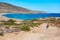 Man walking to Prasonisi beach full of windsurfers Rhodes, Greece