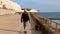 Man walking under Telscombe Cliffs in Sussex 