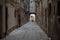 A man walking a a Venetian street. Streets of Venice, Italy