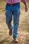 Man is walking wearing jeans pant - stock photograph