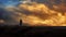 Man Walks Across Horizon With Moving Sunset Sky