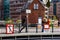 Man walks across a small canal bridge