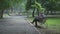 A man walks along the embankment of the city pond.