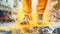 A man walks cautiously through a puddle