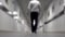 A man walks down the corridor. Blurred background. Young man walking down the long corridor
