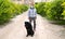 A man walks with his dog outdoors after Spain imposed a lockdown to slow down the spread of the coronavirus disease in Murcia,