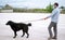 A man walks with his dog outdoors after Spain imposed a lockdown to slow down the spread of the coronavirus disease in Murcia,