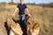 Man walks between lion and lioness