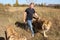 Man walks between lion and lioness