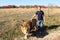 Man walks next to an adult lion