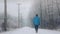 Man Walks On Road In The Snow