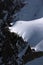 A man walks to edge of steep mountain in Mont Blanc massif in France