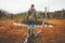 Man wanderer standing alone in swamp forest