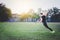 man warming up and practicing javelin throw in yard